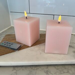 Set of 2 cute pink ribbed flameless candles. Timer & remote.